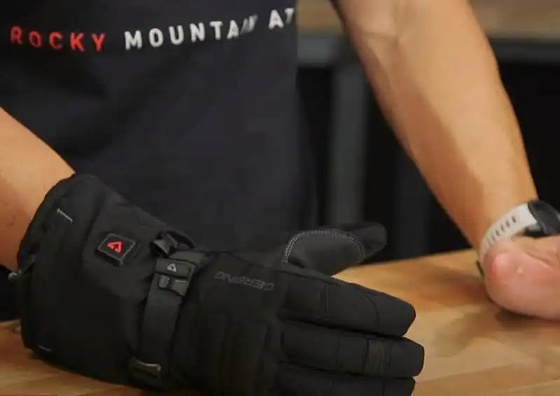 An image showing how the Gerbing 7V S7 Battery Heated Gloves will protect your hands in a spill.